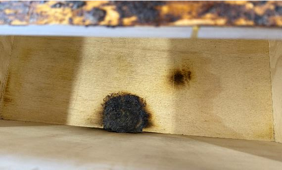 A burnt spot on a wall

AI-generated content may be incorrect., Picture